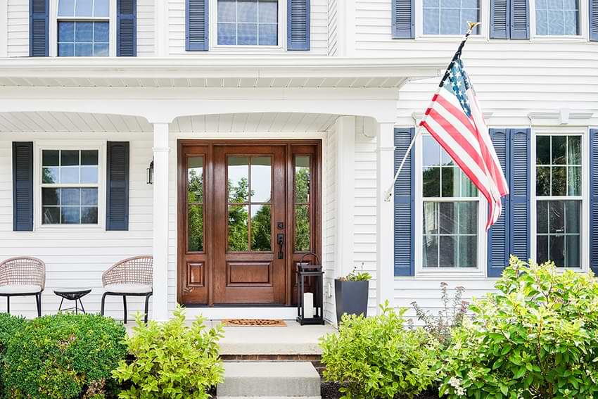 home with flag in front